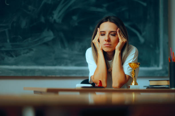 istock Stressed Teacher Suffering from a Migraine at the Workplace 2154665811