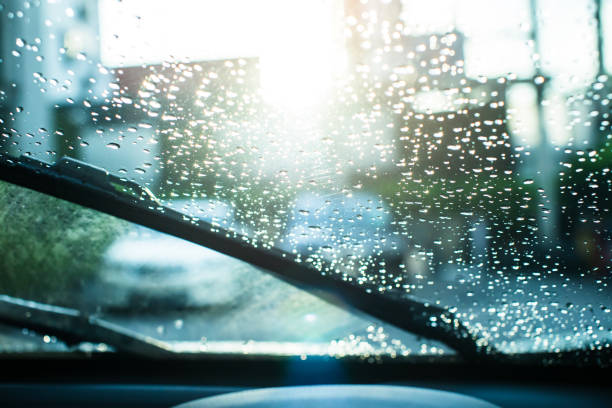 istock Selective focus to rain droplet with wiper on windshield. Windshield wipers of car. 2154673837