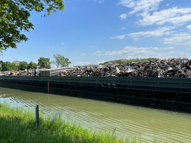 Ship on German river Neckar carrying scrap metal and junk