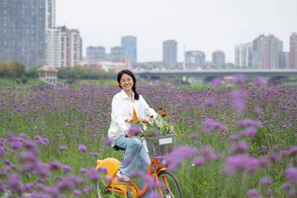 The girl is riding a bicycle in Verbena