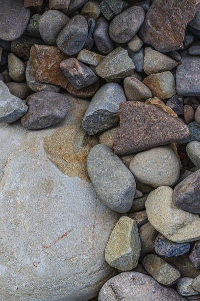 istock Top view of round river pebbles stones floor 2154675981