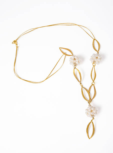 istock Gold chain with pearl necklace isolated on white background 2154681329