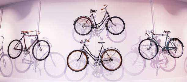 istock Old bicycles hang on a white wall as decorations 2154683508