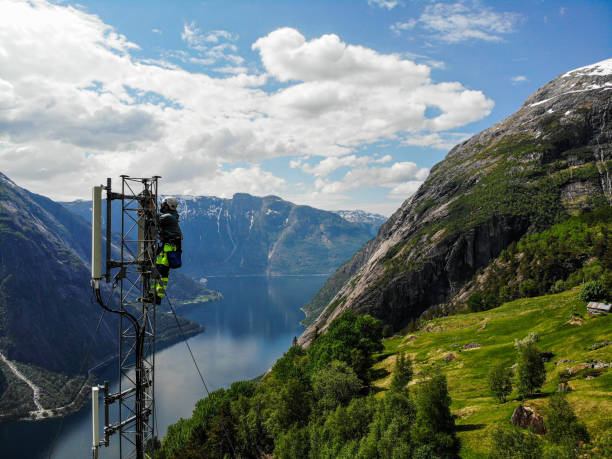 istock Telecommunication tower and mast installations antenna with 5G, 4G LTE, 3G UMTS, GSM, DCS bands stock photo taken by drone in Scandinavia 2154684224