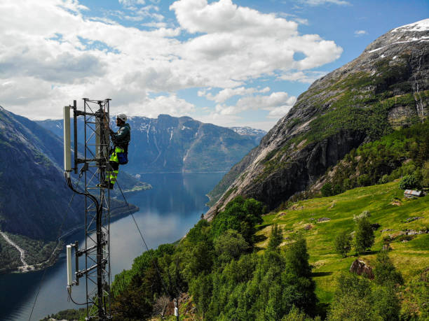 istock Telecommunication tower and mast installations antenna with 5G, 4G LTE, 3G UMTS, GSM, DCS bands stock photo taken by drone in Scandinavia 2154684225