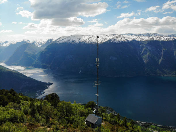 istock Working at high telecommunications mast installing 5G 4G LTE antennas for Internet 2154684355