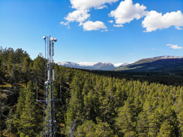 istock Working on installation of 5G telecommunications antennas with great view 2154684366
