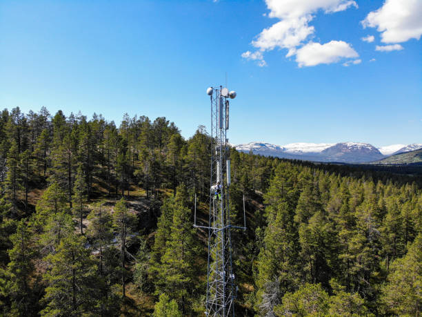 istock Working on installation of 5G telecommunications antennas with great view 2154684368