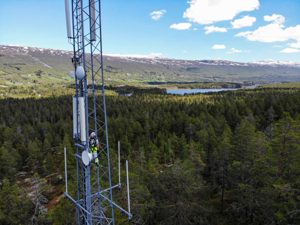 istock Working on installation of 5G telecommunications antennas with great view 2154684383