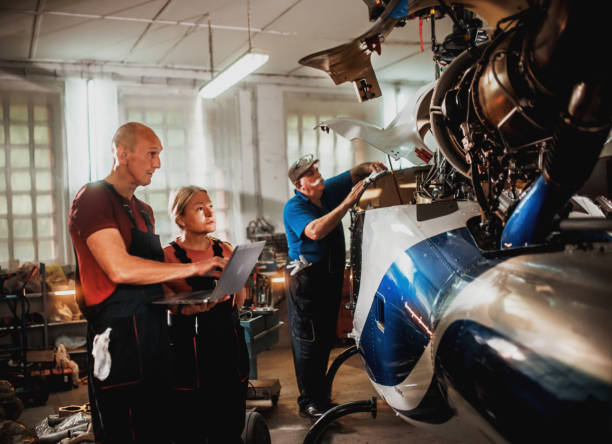 istock females and male engineers working with helicopters 2154684406