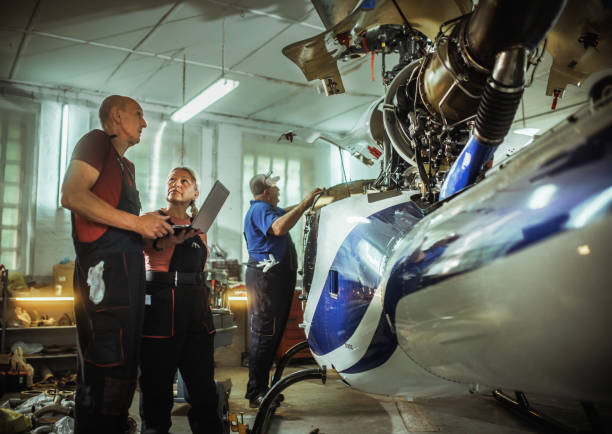 istock females and male engineers working with helicopters 2154684435