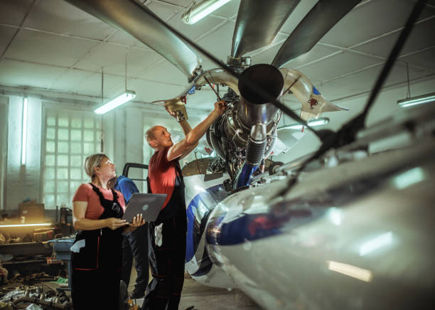 istock females and male engineers working with helicopters 2154684447