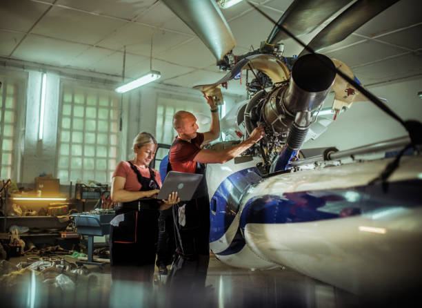 istock females and male engineers working with helicopters 2154684456