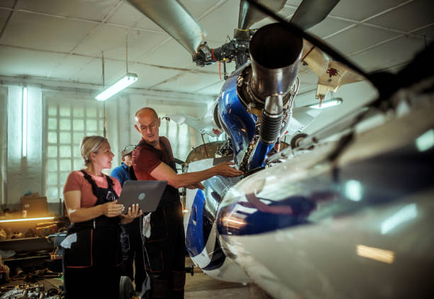 istock females and male engineers working with helicopters 2154684465