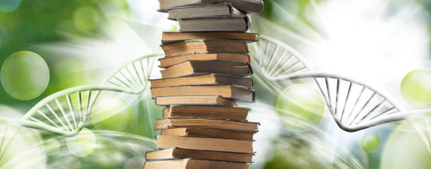 istock stack of books, stylized DNA models on a green blurred background 2154684489