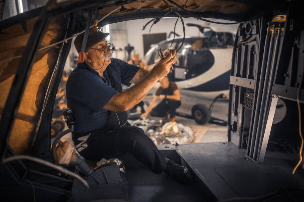 istock females and male engineers working with helicopters 2154684539