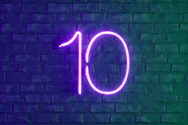 Silver colored number 1 with a gold outline on blue and pink background.