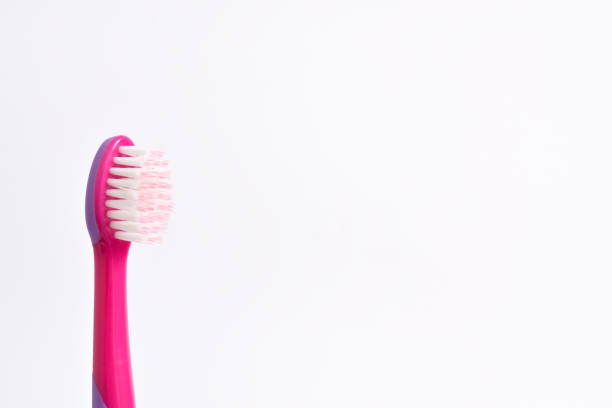Close up of Colorful Children's Toothbrushes on Isolated Background