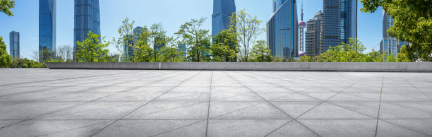 Panoramic skyline and modern business office buildings with empty road,empty concrete square floor.
