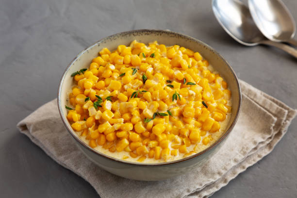 istock Homemade Slow Cooker Creamed Corn in a Bowl on a gray background, side view. 2154689476
