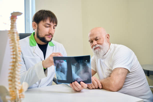 istock Two men looking at a patient chest x-ray 2154690401