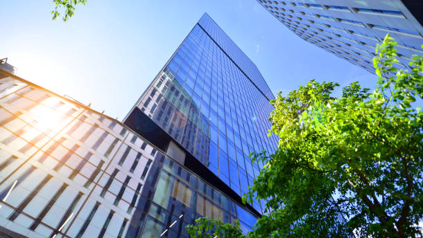 istock Sustainable glass office building with trees for reducing carbon dioxide. 2154691620