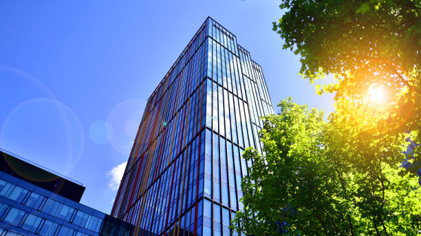 istock Sustainable glass office building with trees for reducing carbon dioxide. 2154691666