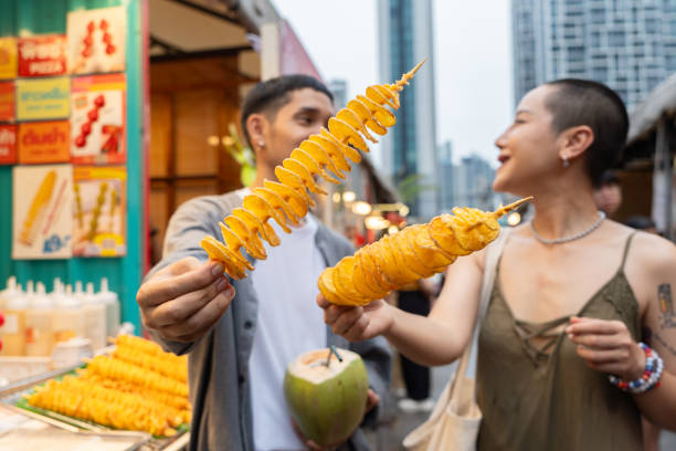 Asian couple enjoying with fried potato