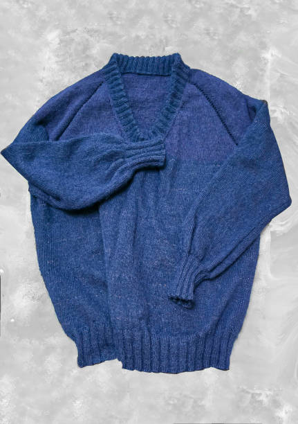 istock Handmade knitted products. Knitted fabric made of dark threads. Woman pullover. 2154698091
