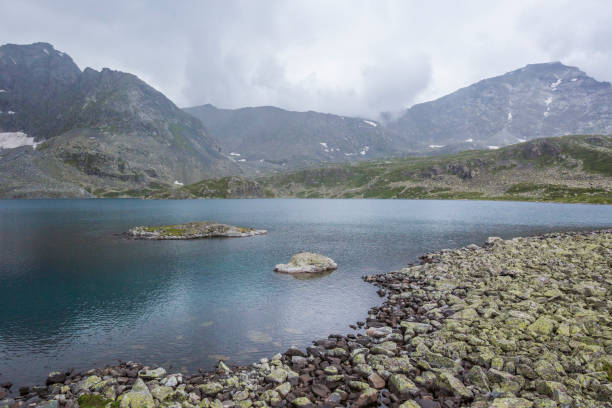 Alla-Askyr Lake. Altai mountains foggy landscape. Russia