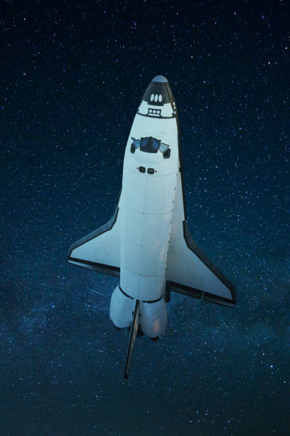 Space shuttle flies in space against the blue background of stars. Space shuttle taking off on a mission