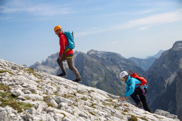 istock Two mountaineers walking on the edge 2154699409