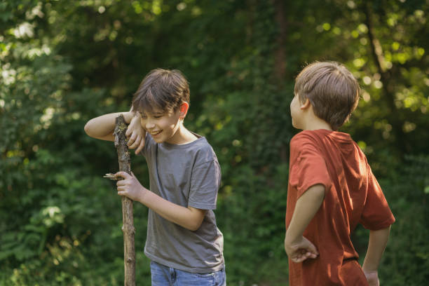 istock Boys talking an laughing in the forest 2154699532