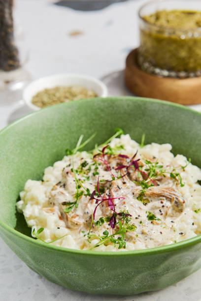 istock Delicious Mushroom Risotto in Green Ceramic Bowl Captured in Natural Light Setting 2154700292