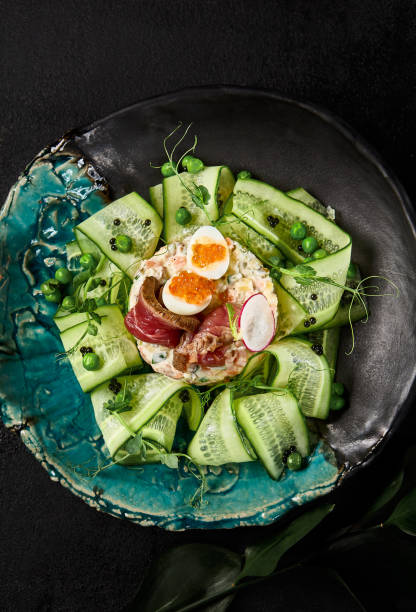istock Gourmet Olivier Salad with Roast Beef and Fresh Cucumbers on Elegant Tableware 2154700371
