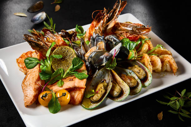 istock Gourmet Seafood Platter Featuring Mussels, Salmon, Shrimp, and Octopus on Elegant Dining Table 2154701797