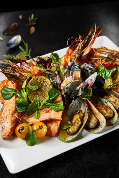 istock Gourmet Seafood Platter Featuring Mussels, Salmon, Prawns, and Octopus on Elegant Tableware 2154701800