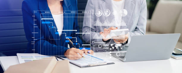 istock Businesswoman hand Project manager working and update tasks and Gantt chart scheduling virtual diagram. 2154702052