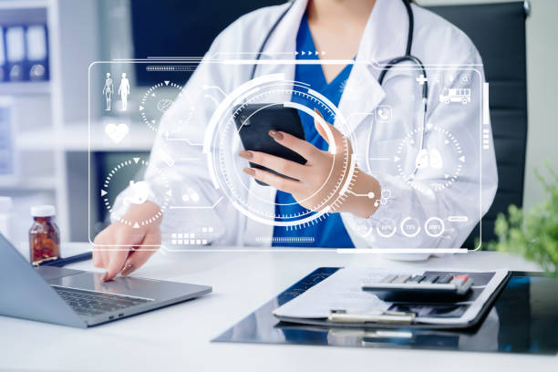 istock Doctor works with mobile devices on the Internet in the office. on hologram modern virtual icon 2154702113