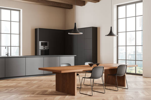istock Beige home kitchen interior with cooking and dining zone, panoramic window 2154702760