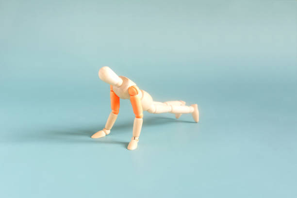The figure of a man doing a physical exercise doing push-ups from the floor close-up