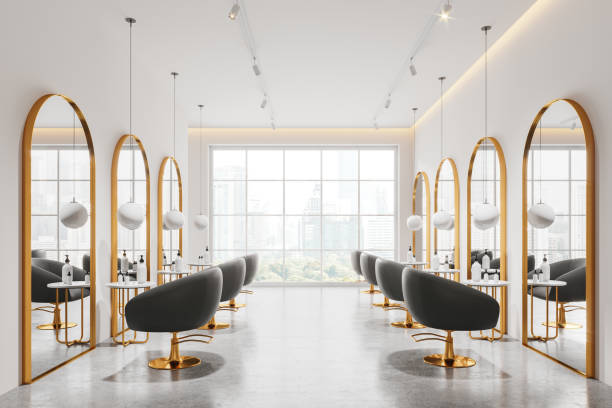istock Luxury beauty salon interior with armchairs, cosmetics on table near window 2154702965