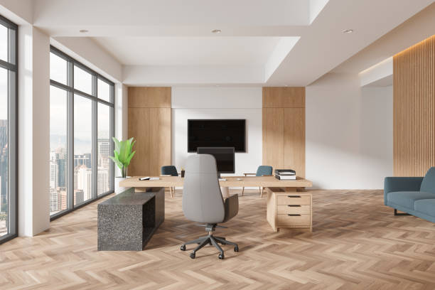 istock Modern wooden office interior with work desk, chill zone and panoramic window 2154703450