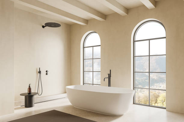 istock Beige hotel bathroom interior with tub, douche and panoramic window 2154703610