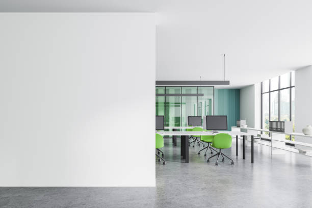 istock Office coworking interior with pc computers in row and window. Mockup wall 2154704197