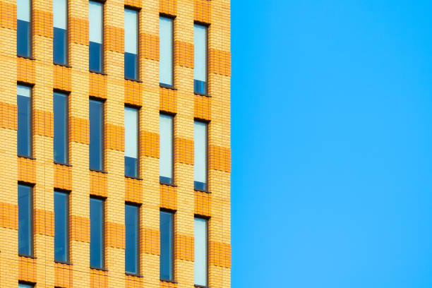 A lot of windows on a skyscraper building. Urban textures and backgrounds. Modern architecture and design. Building details.