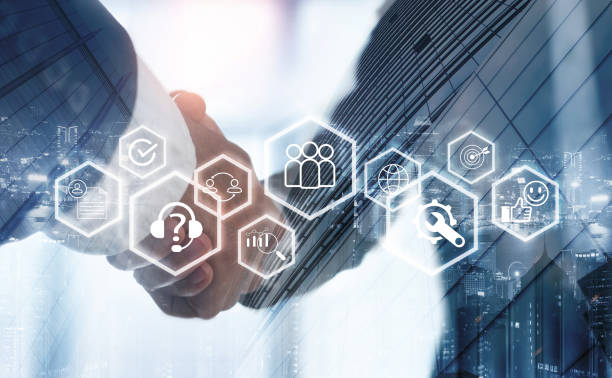 istock CRM Customer Relationship Management concept. Businessman making a handshake, customer service team with CRM database analysis. Business strategies for business development 2154705448