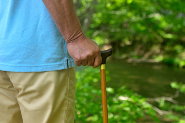 Senior man walking with a cane