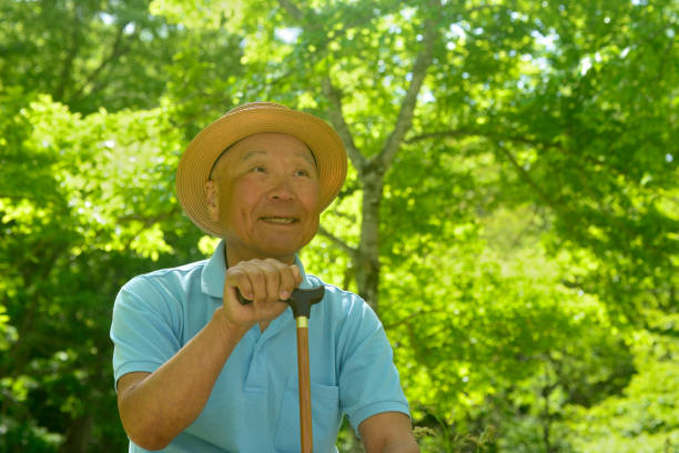 istock Senior man walking with a cane 2154707492