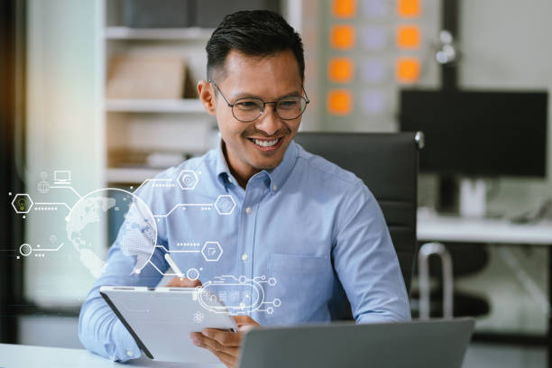 istock Learning online working concept. Businessman working on tablet and laptop computer, searching working in office. 2154707540